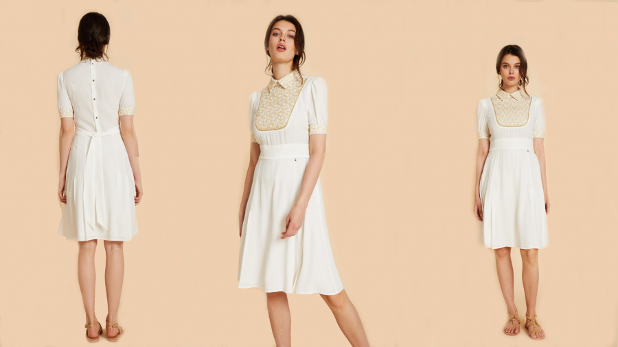 Vestido blanco con pechera bordada y lazada en la cintura de la colección de Pati Conde by Dandara