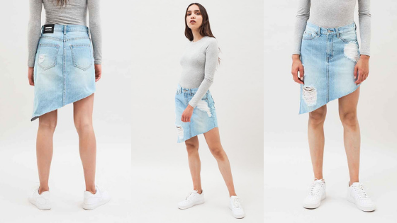 Falda vaquera con desgastes y corte asimétrico de la firma Dr. Denim