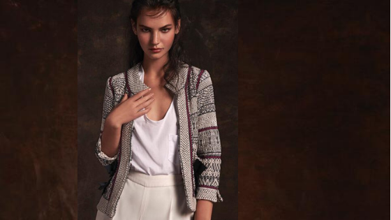 Chaqueta Chanel de punto con detalles en los bolsillos de la firma The Extreme Collection